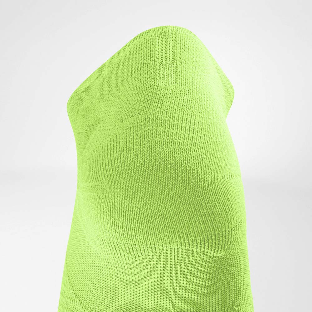 Kurze Sportsocken ultraleicht limegreen Detail Heel Protection Detailansicht des Achillessehnenschutzbereiches der grünen kurzen leichten Laufsocke