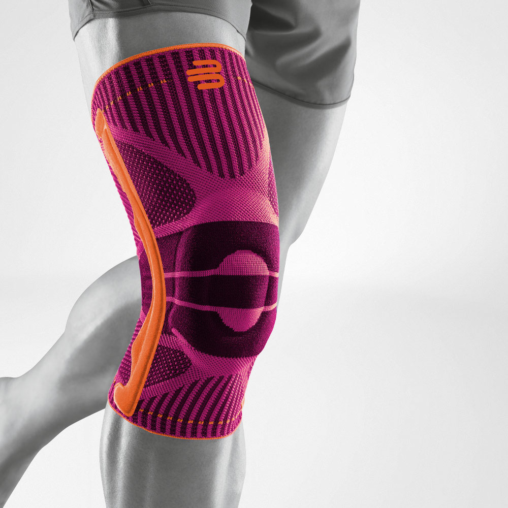 Komplettansicht einer pinken Kniebandage für den Sport am stilisierten grauen Bein