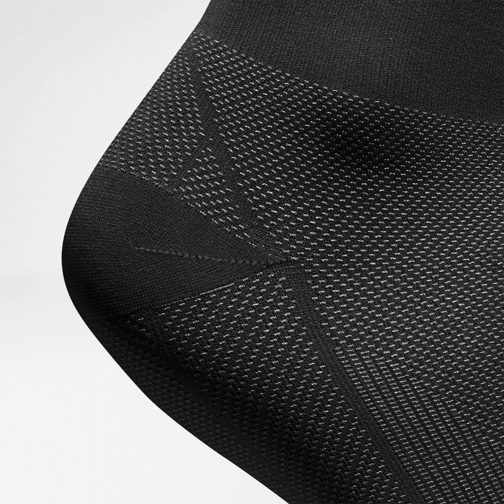 Kompressionssocken Regeneration schwarz Detail Ferse Detailansicht des Fersenbereiches der Sportstsockses zur Regeneration