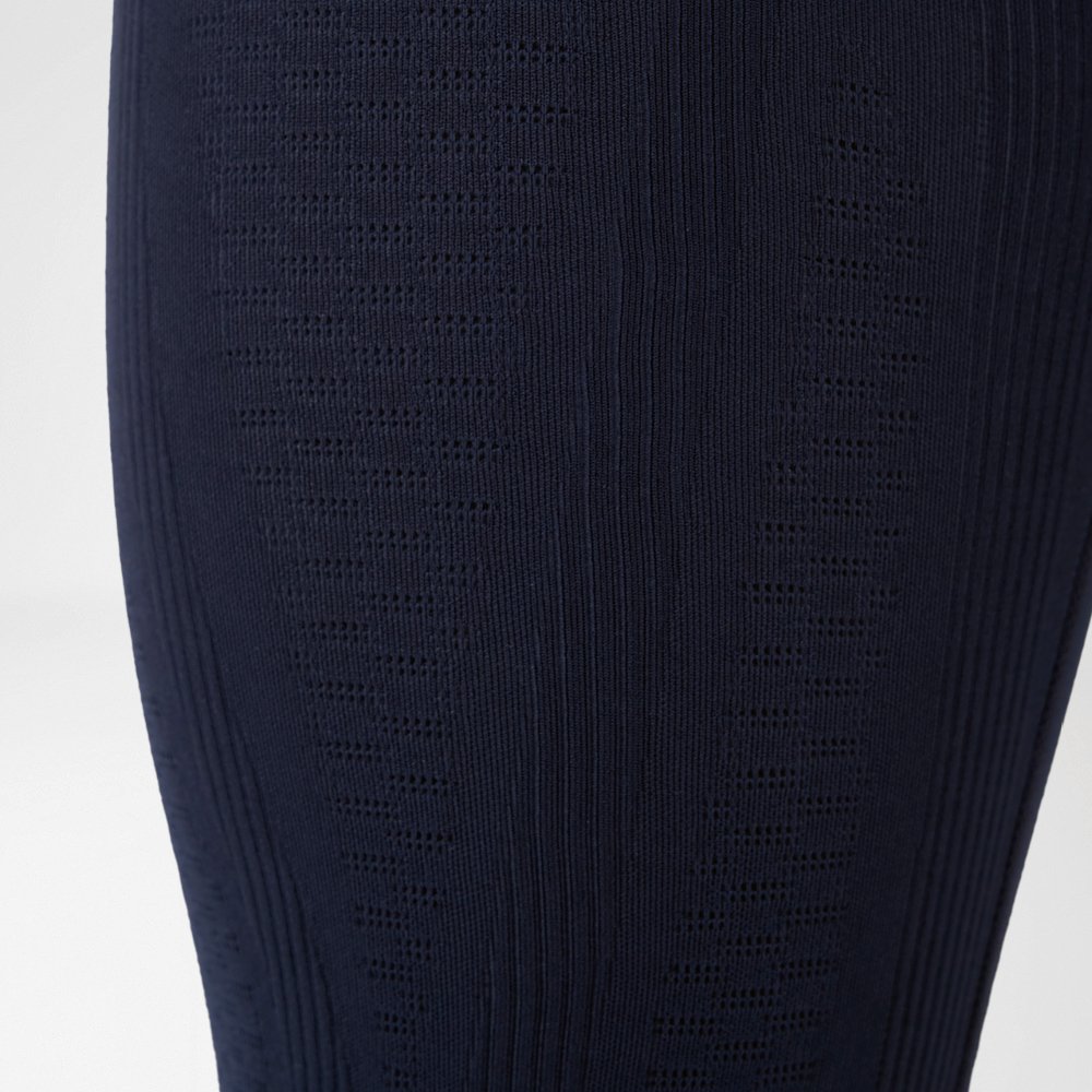 Nahaufnahme einer Kompressionshose mit 3D-Power-Dots und gezielter Kompressionstechnologie.
