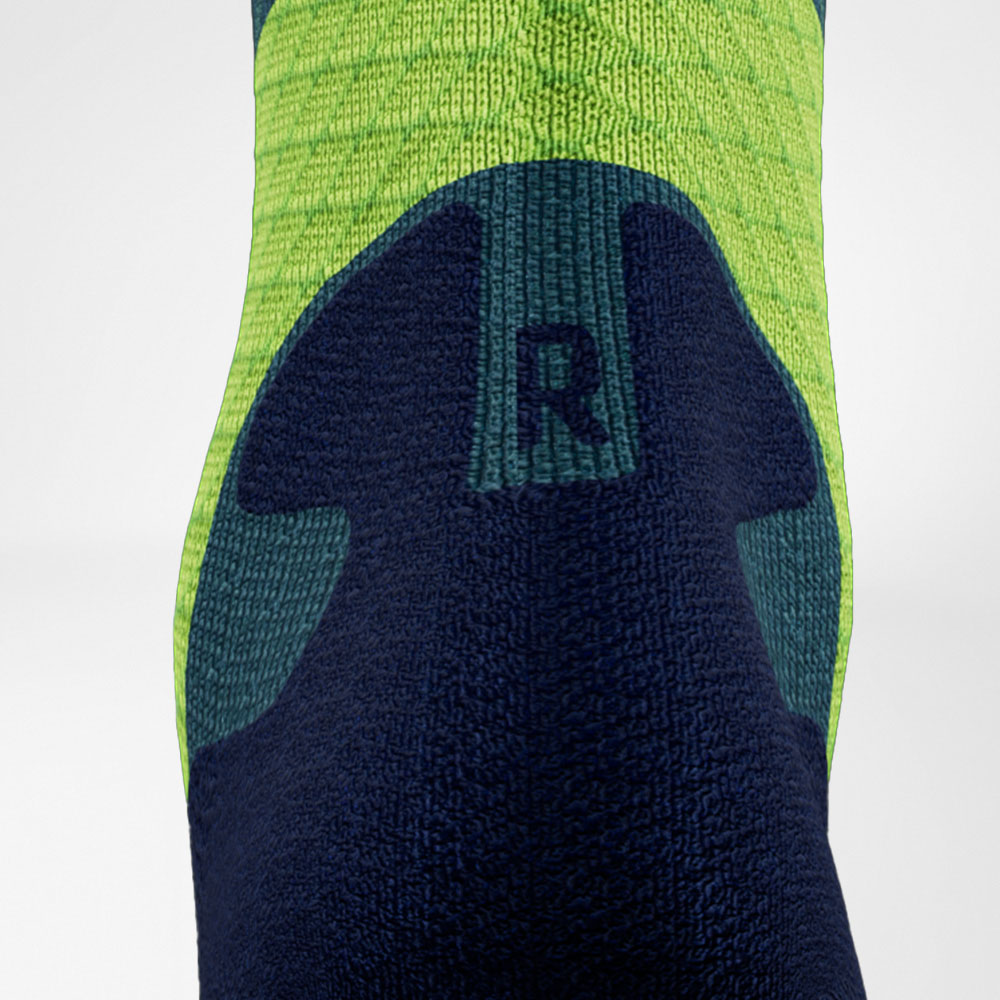 Trailrun-Laufsocken blau-grün Detail Comfort Zone Detailansicht des Achillessehenbereiches der blau-grünen Trailrun - Laufsocken
