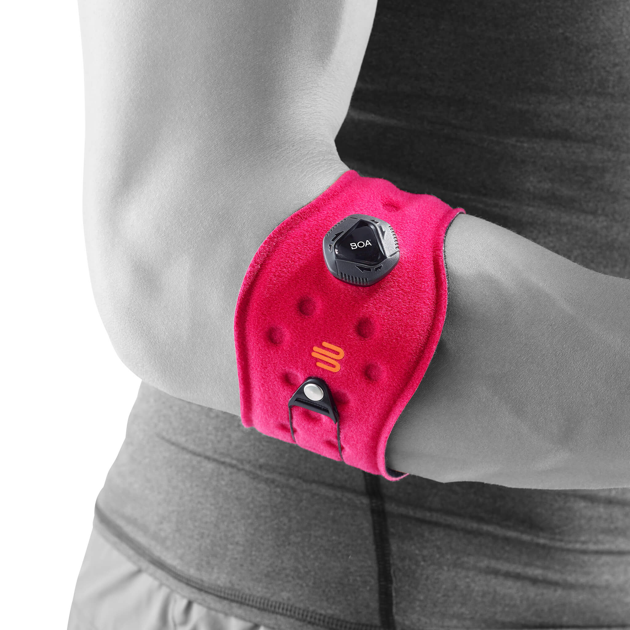 Ellenbogenbandage pink Seitenansicht Komplettaufnahme der pinken Ellenbogenspange am stilisierten grauen Körper